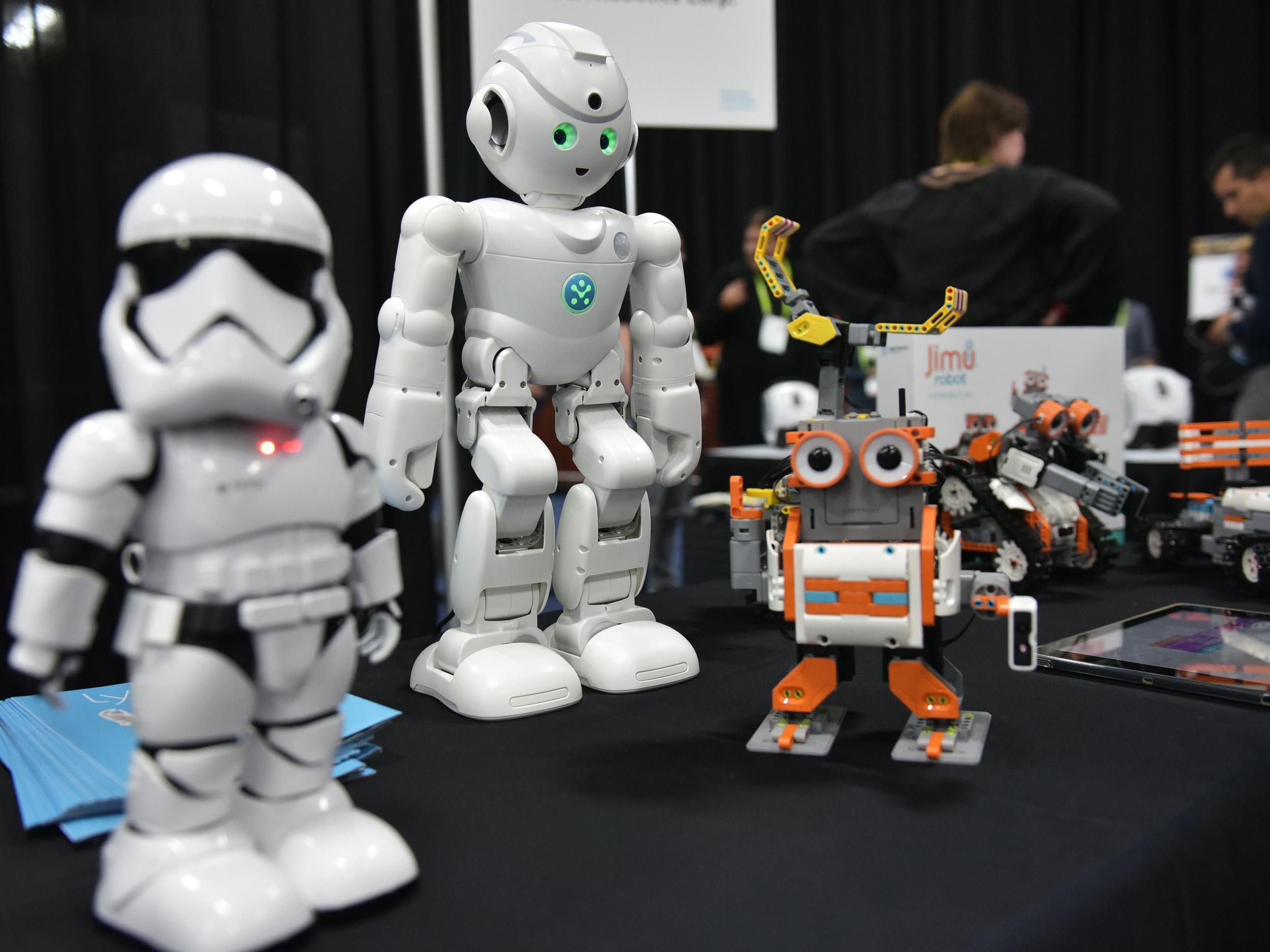 UBTECH robots including the First Order 'Stormtrooper' (L) and the Amazon Alexa voice assistant enabled 'lynx' (C) are seen during the CES Unveiled preview event at the Mandalay Bay Convention Center during CES 2018 in Las Vegas on January 7, 2018