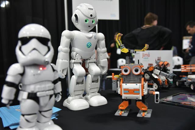 UBTECH robots including the First Order 'Stormtrooper' (L) and the Amazon Alexa voice assistant enabled 'lynx' (C) are seen during the CES Unveiled preview event at the Mandalay Bay Convention Center during CES 2018 in Las Vegas on January 7, 2018