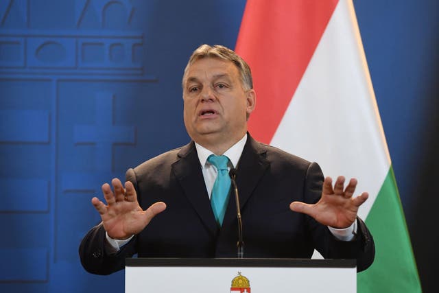 Prime Minister of Hungary Viktor Orban gestures as he gives a press conference at the Hungarian parliament in Budapest on January 3, 2018