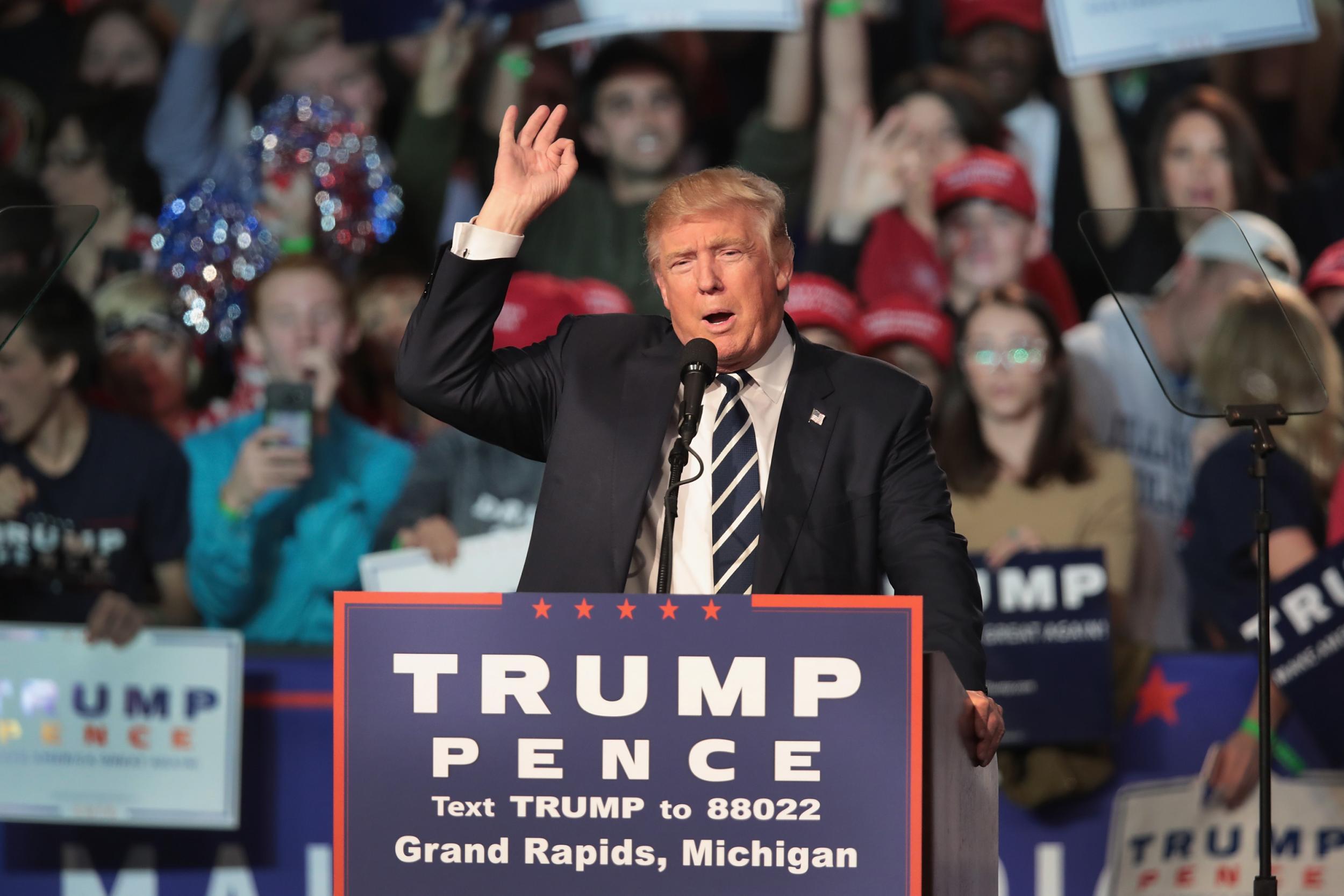 Republican presidential nominee Donald Trump addresses supporters during a campaign rally