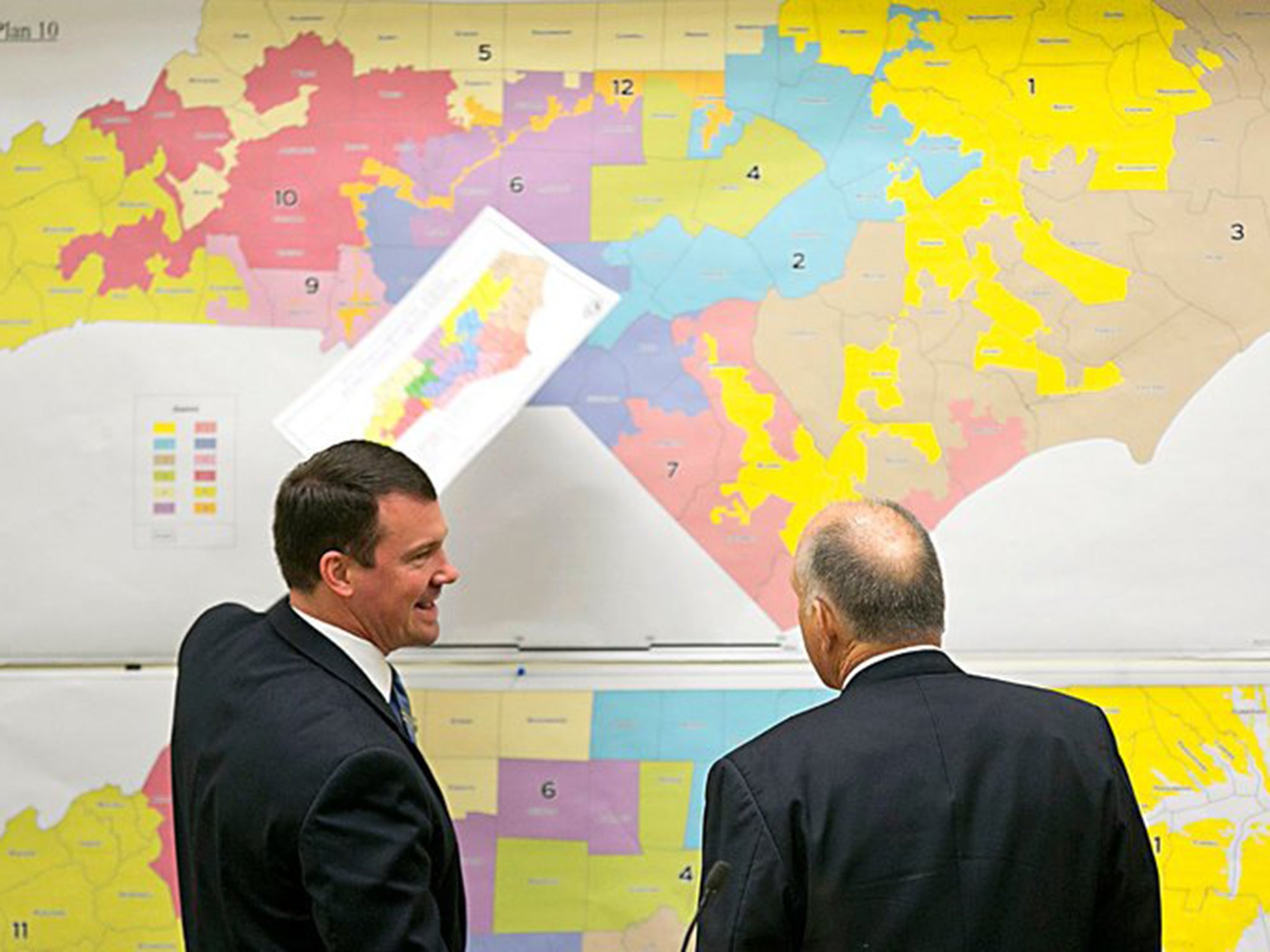Republican state Senators Dan Soucek and Brent Jackson review historical maps. Federal judges say the GOP has been altering constituency boundaries to give it an unfair advantage in upcoming congressional elections