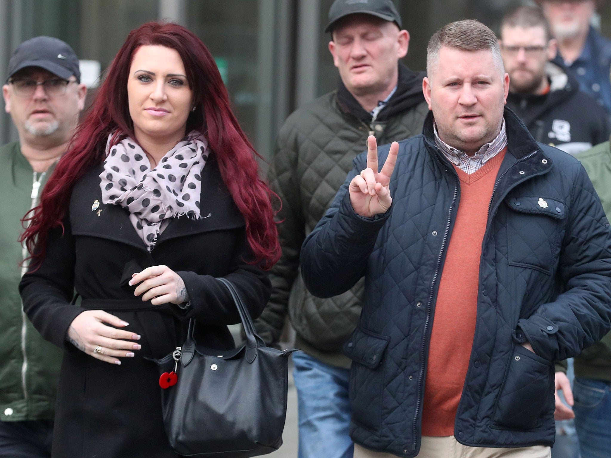 Britain First leader Paul Golding leaves Belfast Magisrates' Court alongside his Jayda Fransen and supporters after a hearing on 10 January