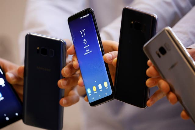 Models pose with Samsung Electronics' Galaxy S8 smartphones during a media event at a company's building in Seoul, South Korea, April 13, 2017