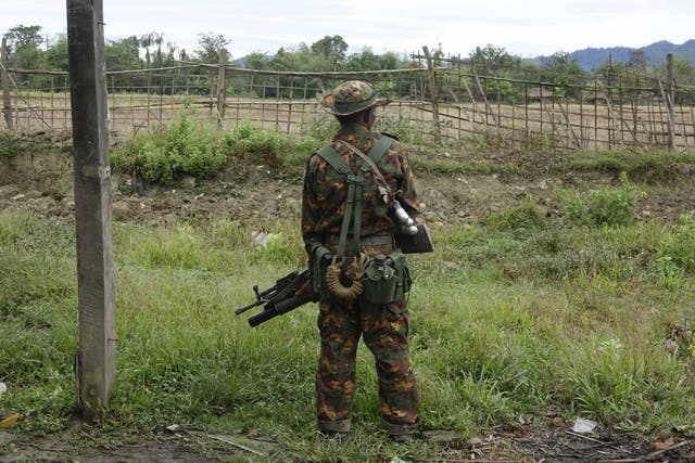An armed soldier stand guards in Maungdaw township, Rakhine state, western Myanmar