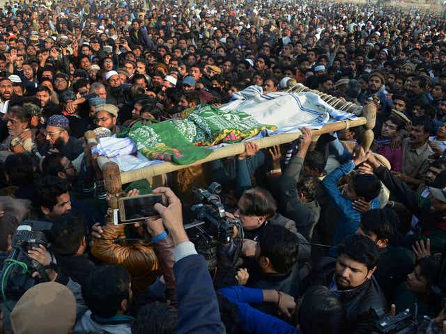 People attend a funeral of a Pakistani girl who was raped and killed, in Kasur, Pakistan