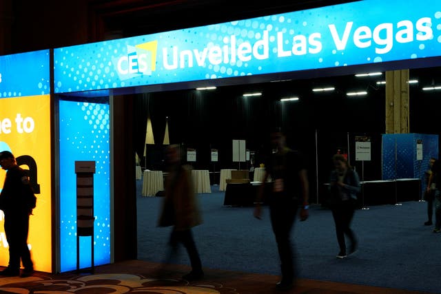 Exhibitors arrive to set up for the opening event at the Consumer Electronics Show in Las Vegas, Nevada
