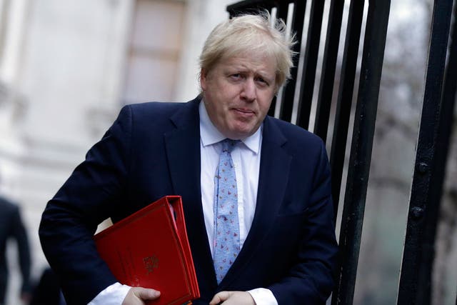 Britain's Foreign Secretary Boris Johnson walks to attend a cabinet meeting at 10 Downing Street