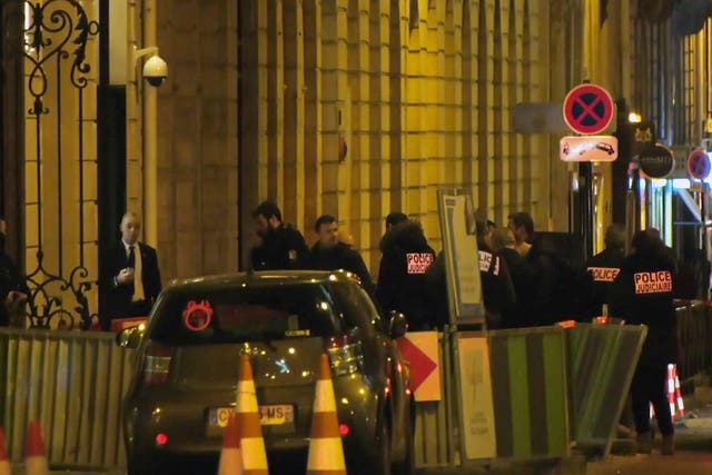 French police attend the scene outside the Ritz Hotel in Paris after a robbery on Wednesday evening