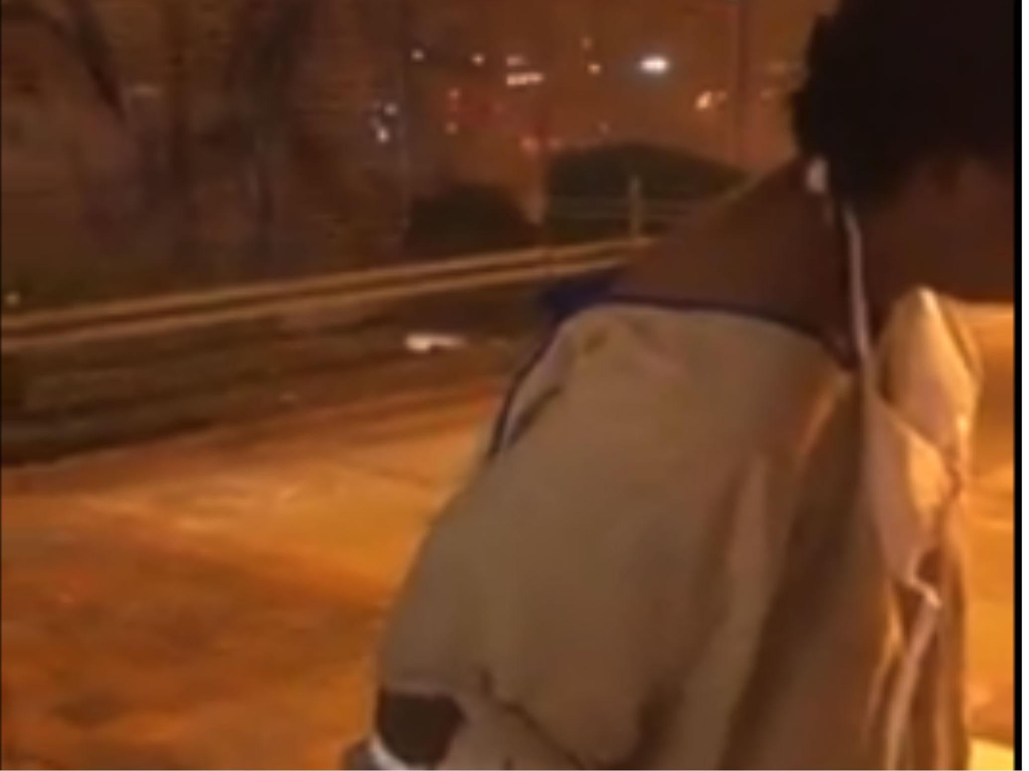 The woman was filmed in the cold after an apparent recent discharge from the hospital