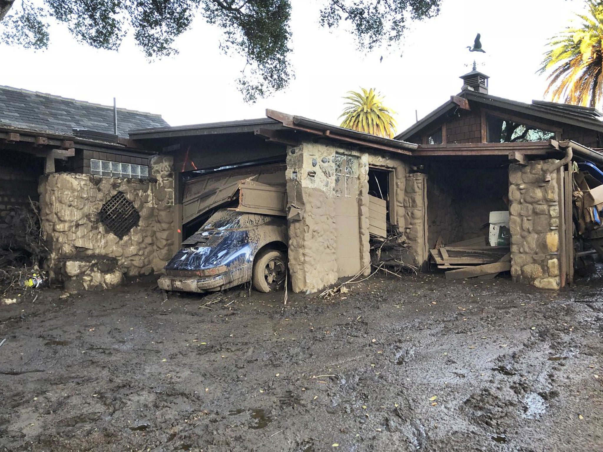 Damage from mud, boulders, and debris that destroyed homes that lined Montecito Creek near East Valley Road in Montecito, California