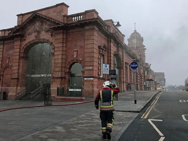 A firefighter walks towards the station.