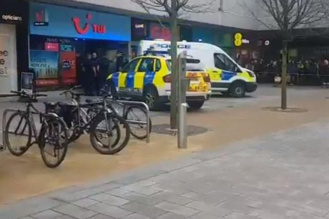 Police cordoned off part of Southport town centre after a woman was killed at a TUI travel agents