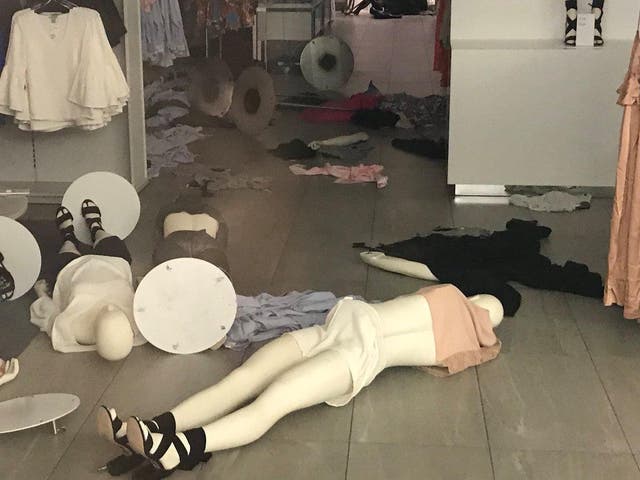 Mannequins lie on the floor of a H&M shop stormed by protesters in Sandton, South Africa