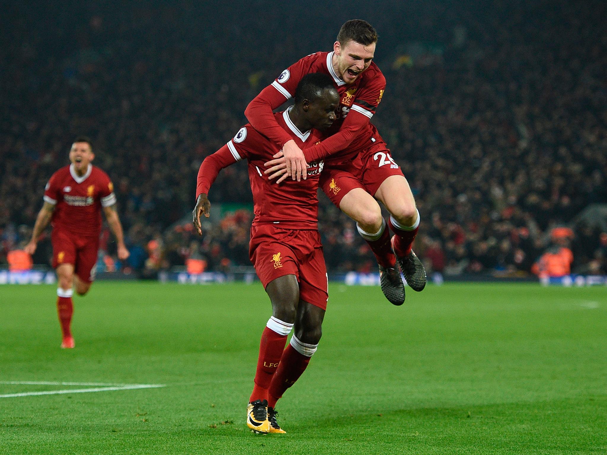 Sadio Mane celebrates with Andrew Robertson after scoring Liverpool's third goal