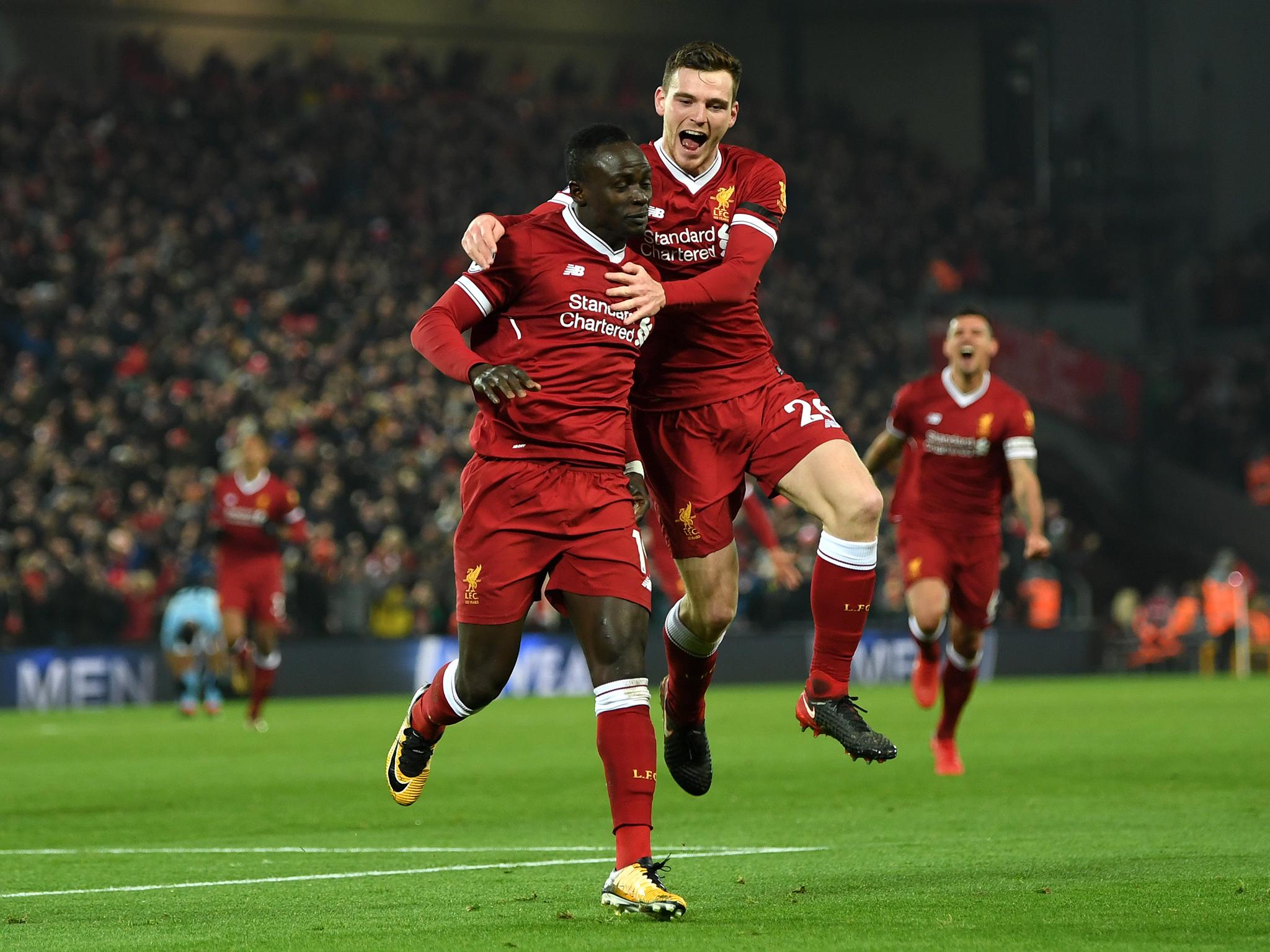Sadio Mane celebrates after scoring Liverpool's third goal