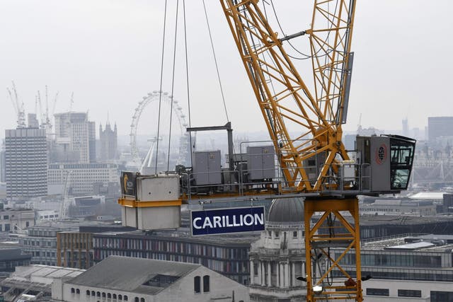 A construction crane showing the branding of British construction company Carillion on a building site in central London