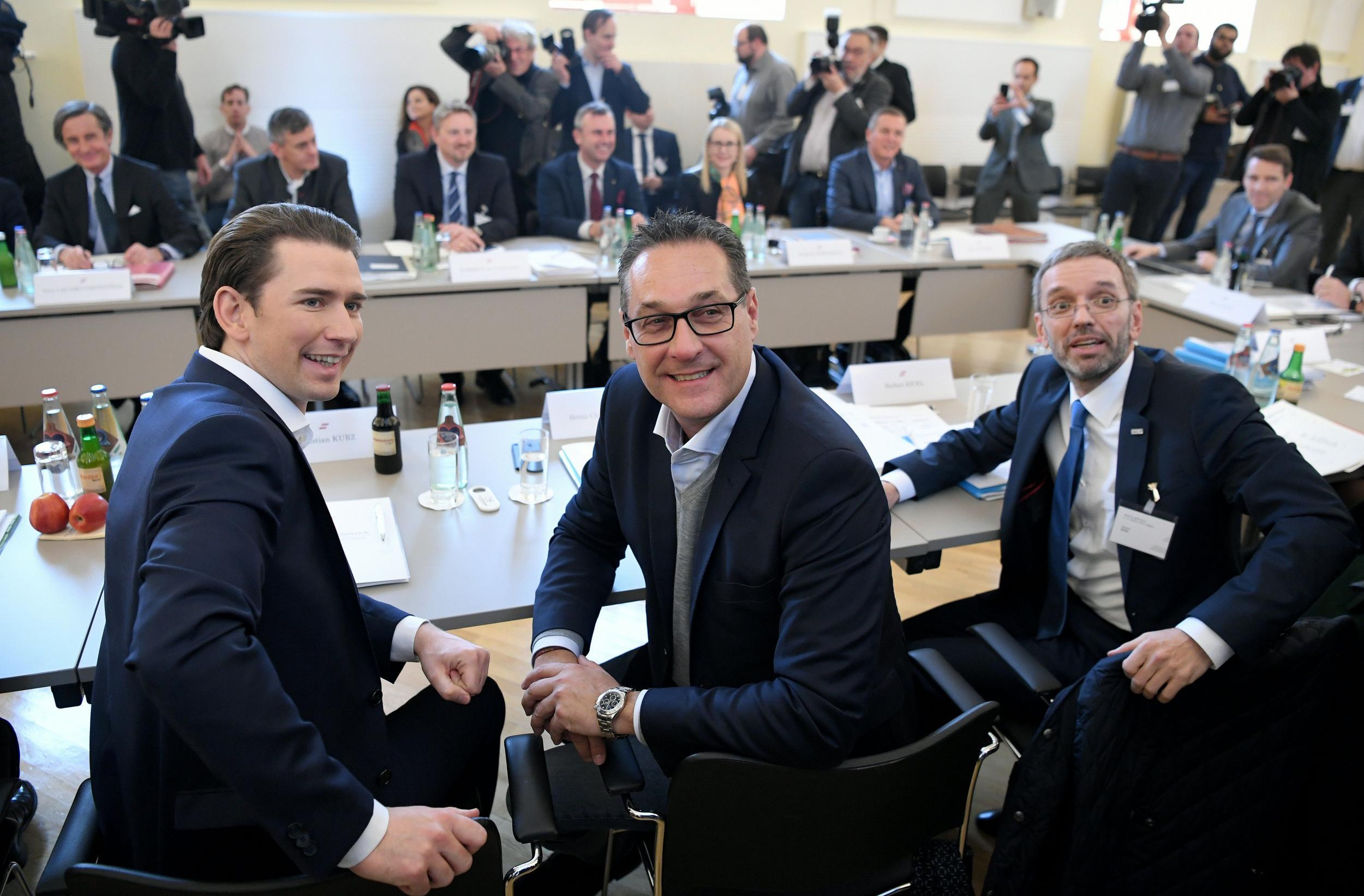 Austrian conservative chancellor Sebastian Kurz, far-right deputy chancellor Heinz Christian Strache, and far-right interior minister Herbert Kickl are in coalition together