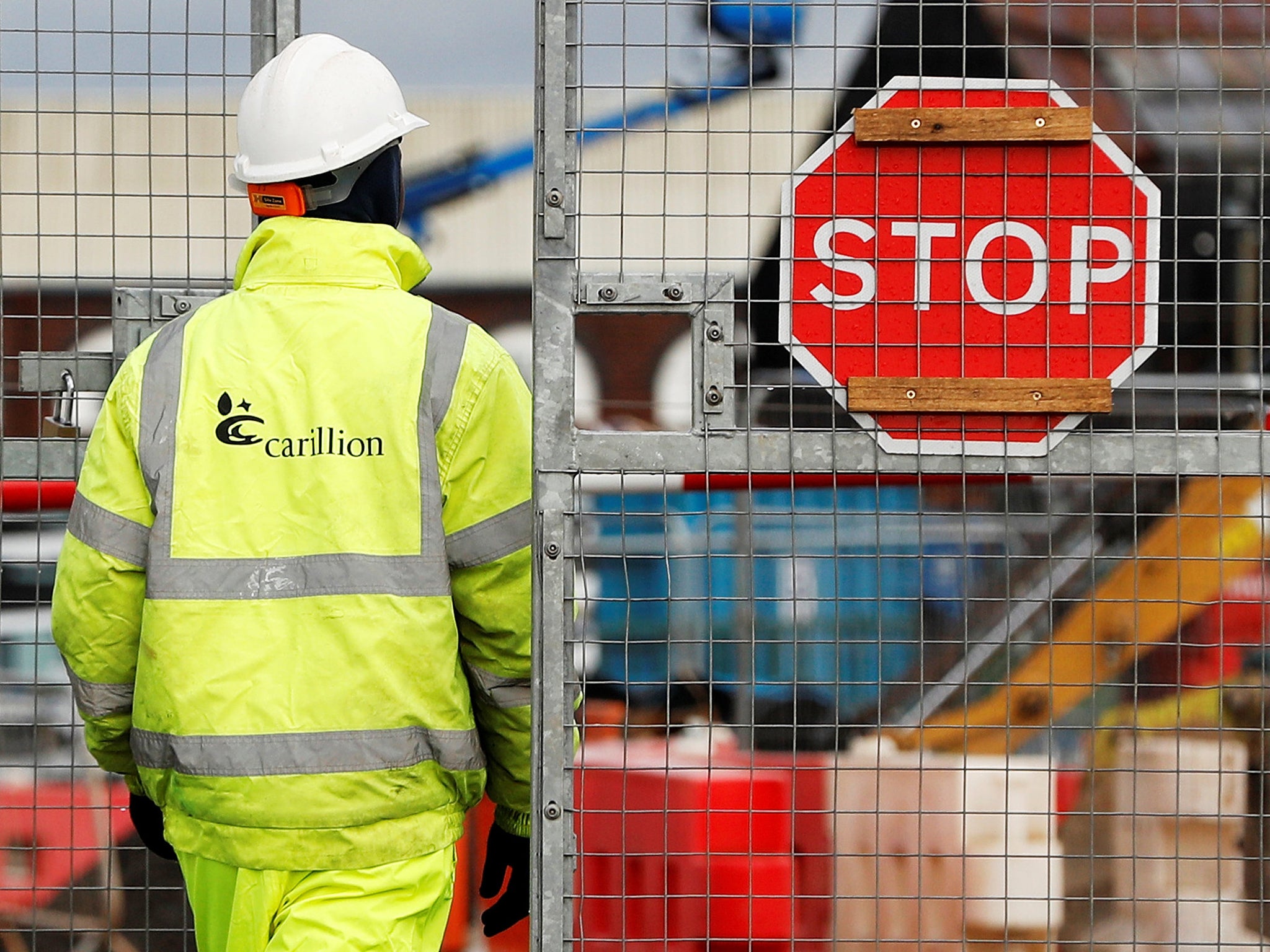 A worker walks into Carillion's Midland Metropolitan Hospital construction site