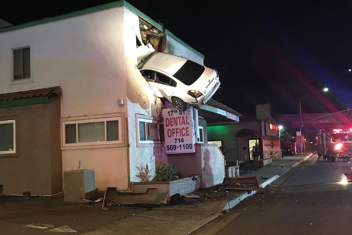 Speeding car flies into the air and crashes into top floor of ...