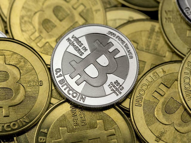Some of Bitcoin enthusiast Mike Caldwell's coins are pictured at his office in this photo illustration in Sandy, Utah, January 31, 2014