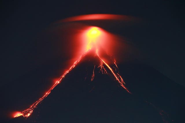 Spectacular lava 'fireworks' shooting from Mount Mayon's crater are drawing tourists to the Philippines' most active volcano