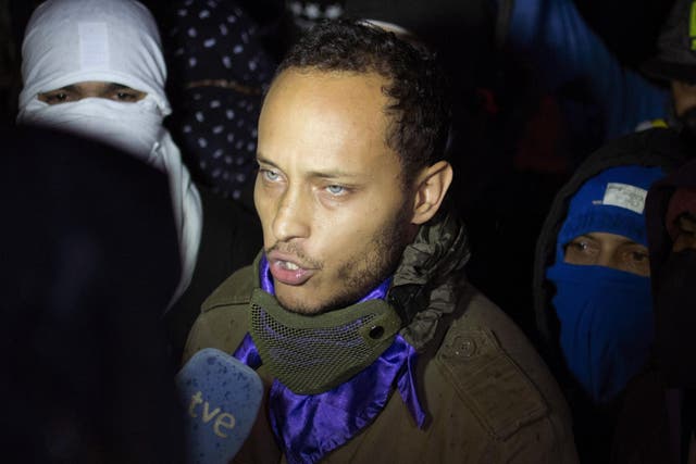 In this July 13, 2017 file photo, Oscar Perez speaks to the press at a night vigil to honor the more than 90 people killed during three months of anti-government protests, in Caracas, Venezuela