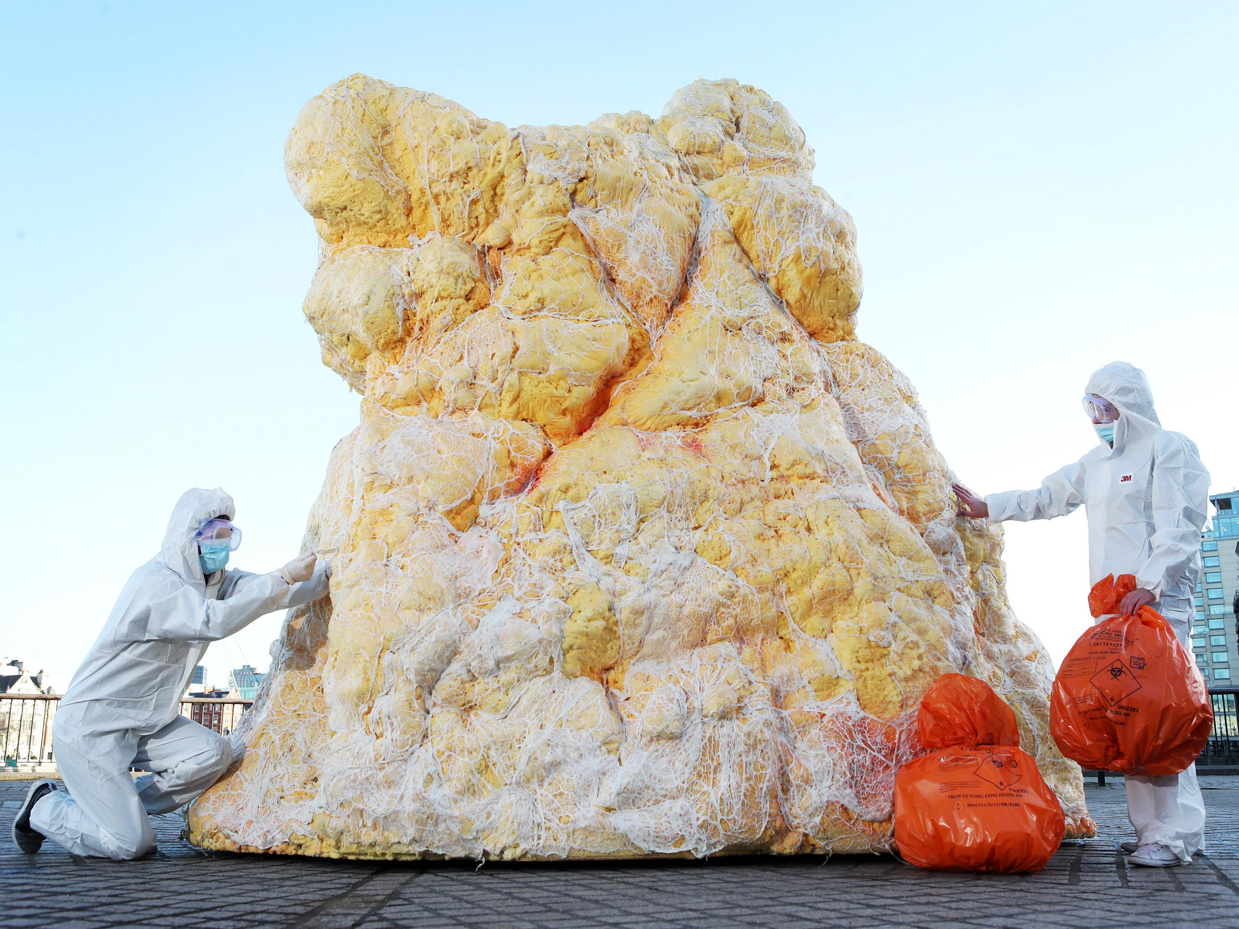 A gigantic lump of real fat measuring 12 feet high appears in London to shock Brits into assessing blood health
