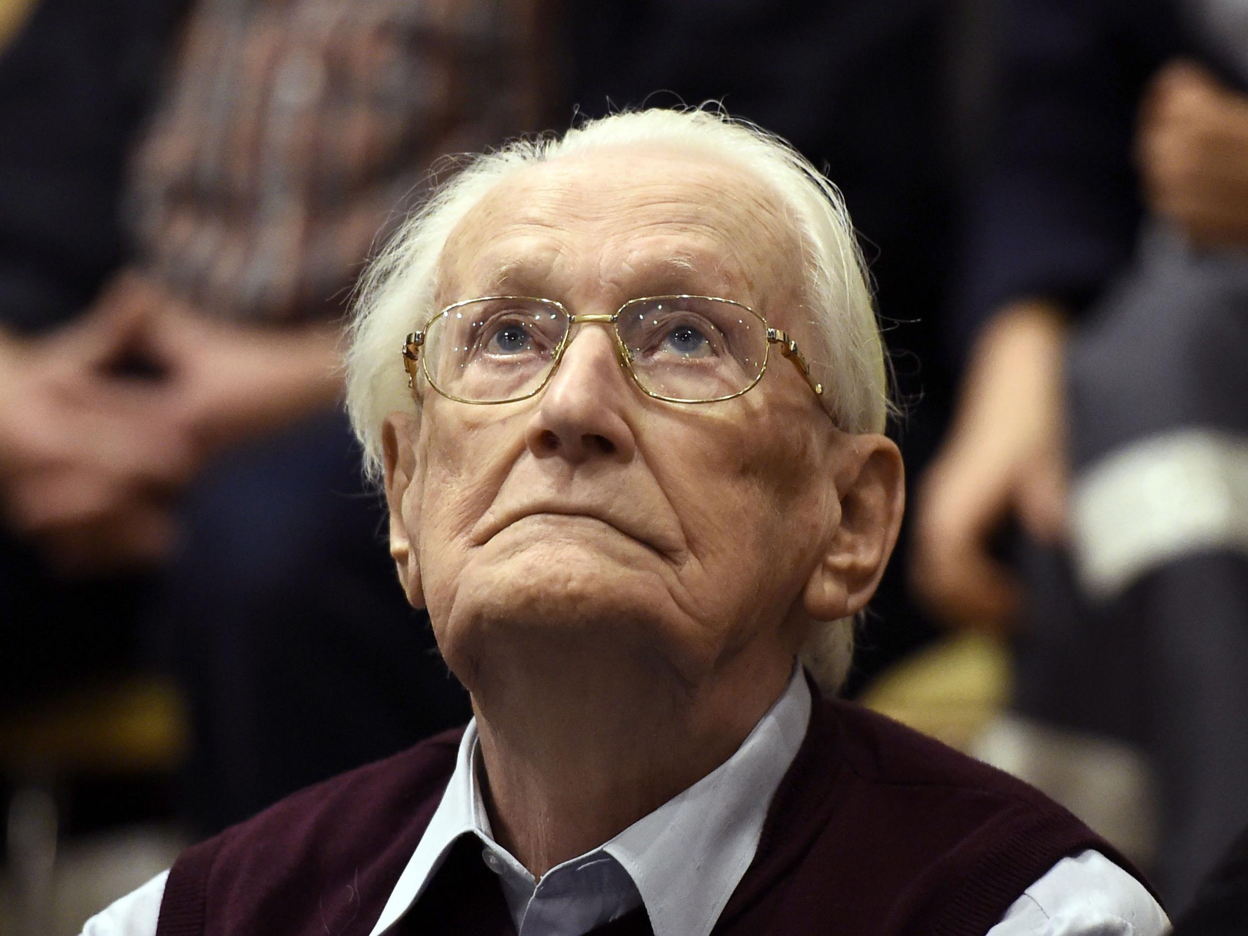 Former SS officer Oskar Groening listens to the verdict of his trial at court in Lueneburg, northern Germany, in 2015