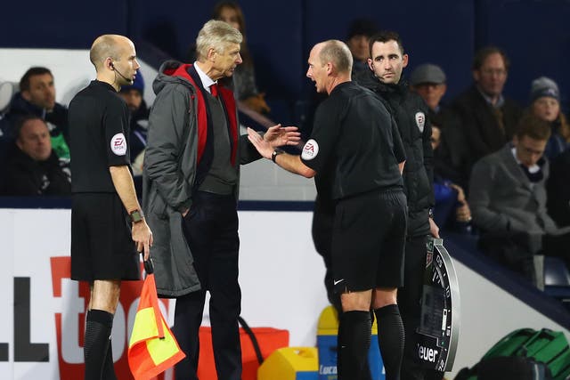 Arsene Wenger confronts Mike Dean during Arsenal's 1-1 draw with West Brom