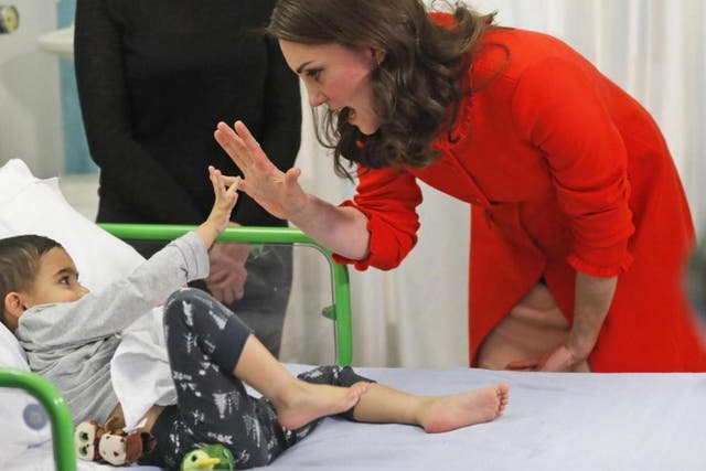 The Duchess of Cambridge with four-year-old Rafael Chana as she officially opens the Mittal Children's Medical Centre during a visit to Great Ormond Street Hospital