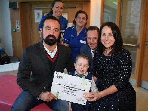 The Independent proprietor, Evgeny Lebedev, with Elliott Livingstone and parents Adrian and Candace