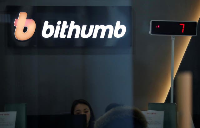<p>The logo of Bithumb is seen at its cryptocurrency exchange in Seoul, South Korea</p>
