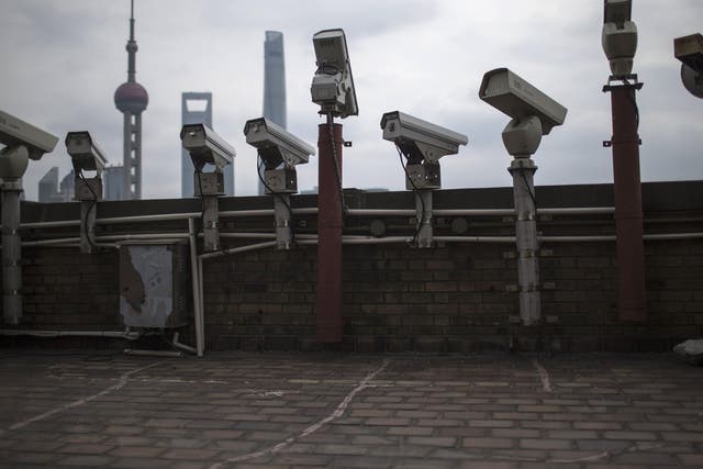 Security cameras are seen on a building in Shanghai