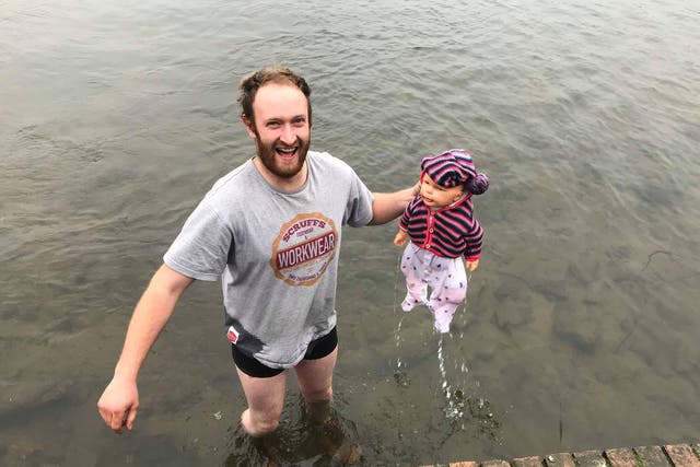 James Dowly, 28, waded through the icy mere to reach the 'baby'