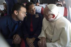 Pope Francis officiates the wedding of two flight attendants mid-air