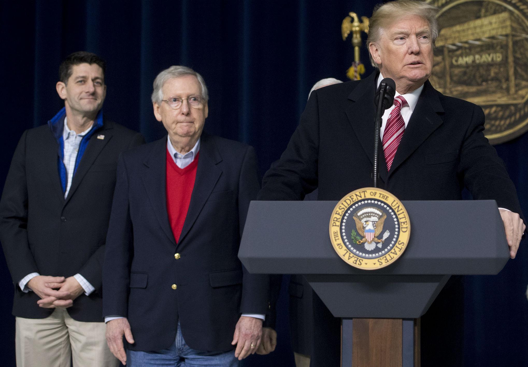 US President Donald Trump speaks alongside Speaker of the House Paul Ryan and Senate Majority Leader Mitch McConnell