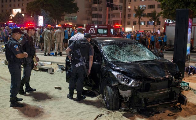 Police inspect car that ploughed into pedestrians at Copacabana beach in Rio de Janeiro,