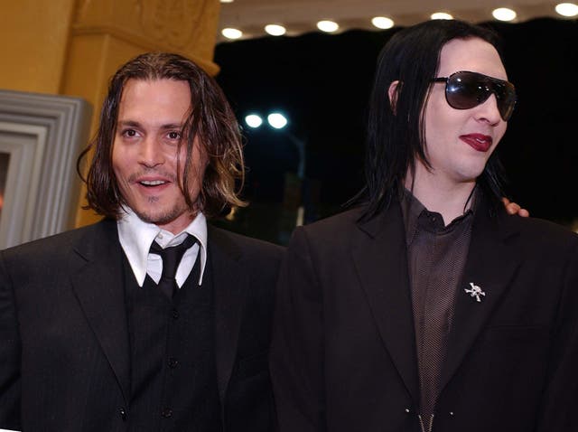 Johnny Depp and Marilyn Manson. Credit: LUCY NICHOLSON/AFP/Getty Images.