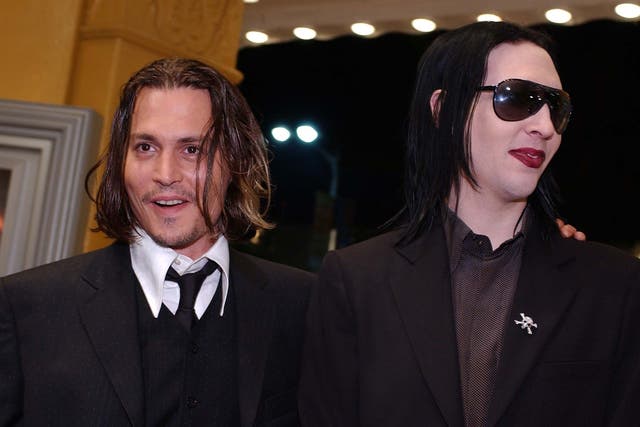 Johnny Depp and Marilyn Manson. Credit: LUCY NICHOLSON/AFP/Getty Images.