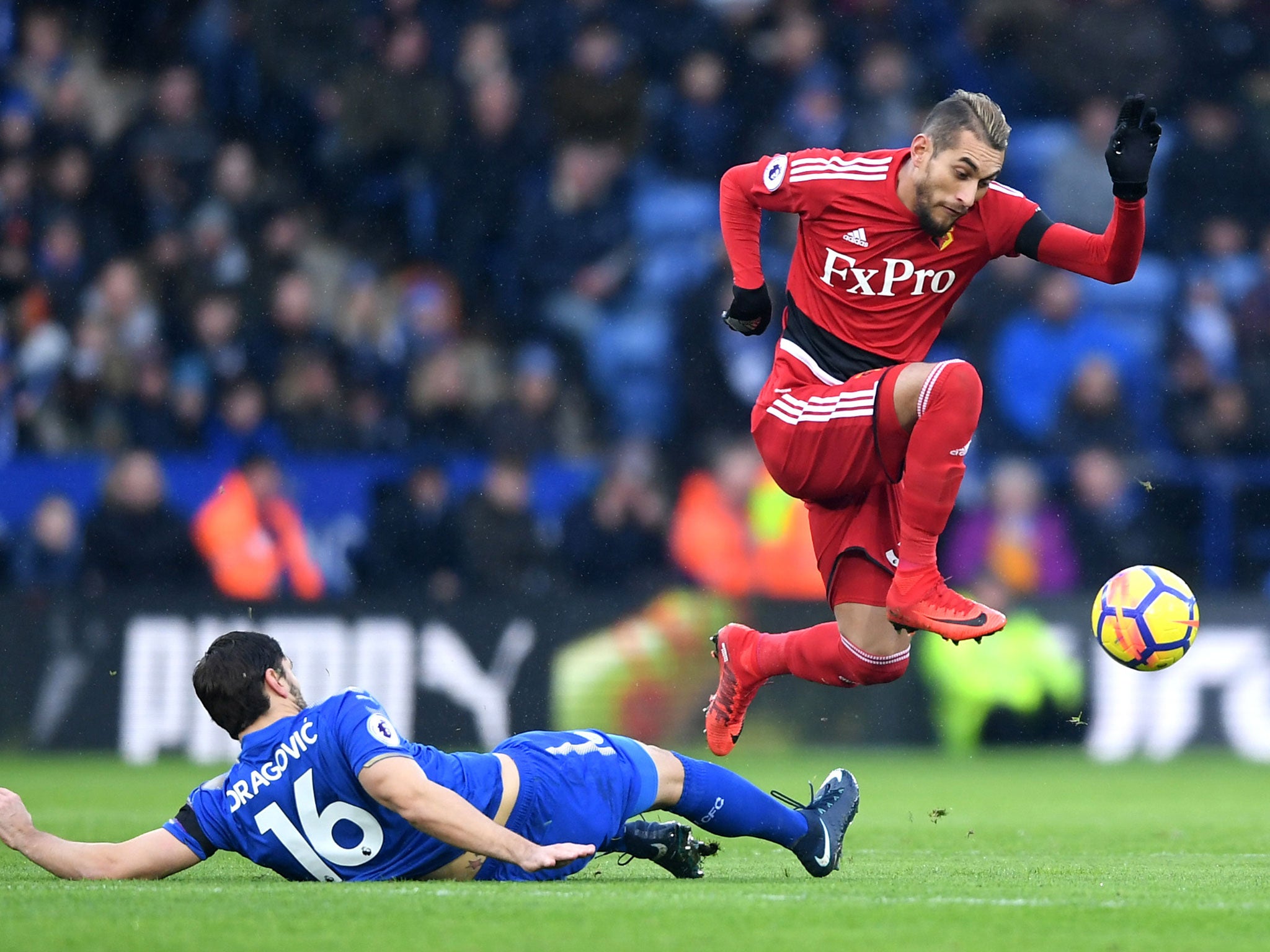 Roberto Pereyra jumps clear of an Aleksander Dragovic challenge