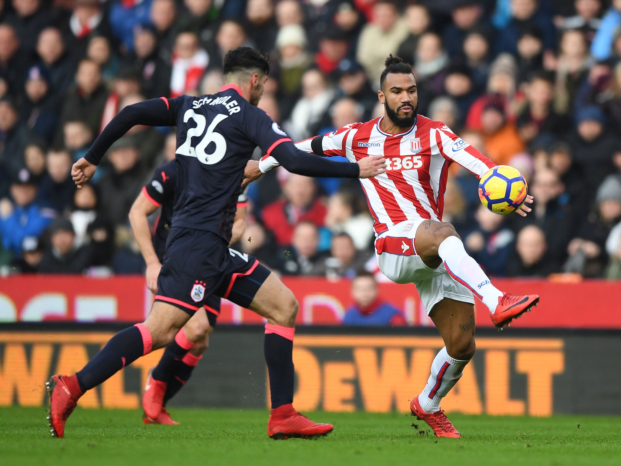 Christopher Schindler threatens as Maxim Choupo-Moting attempts to bring the ball under control