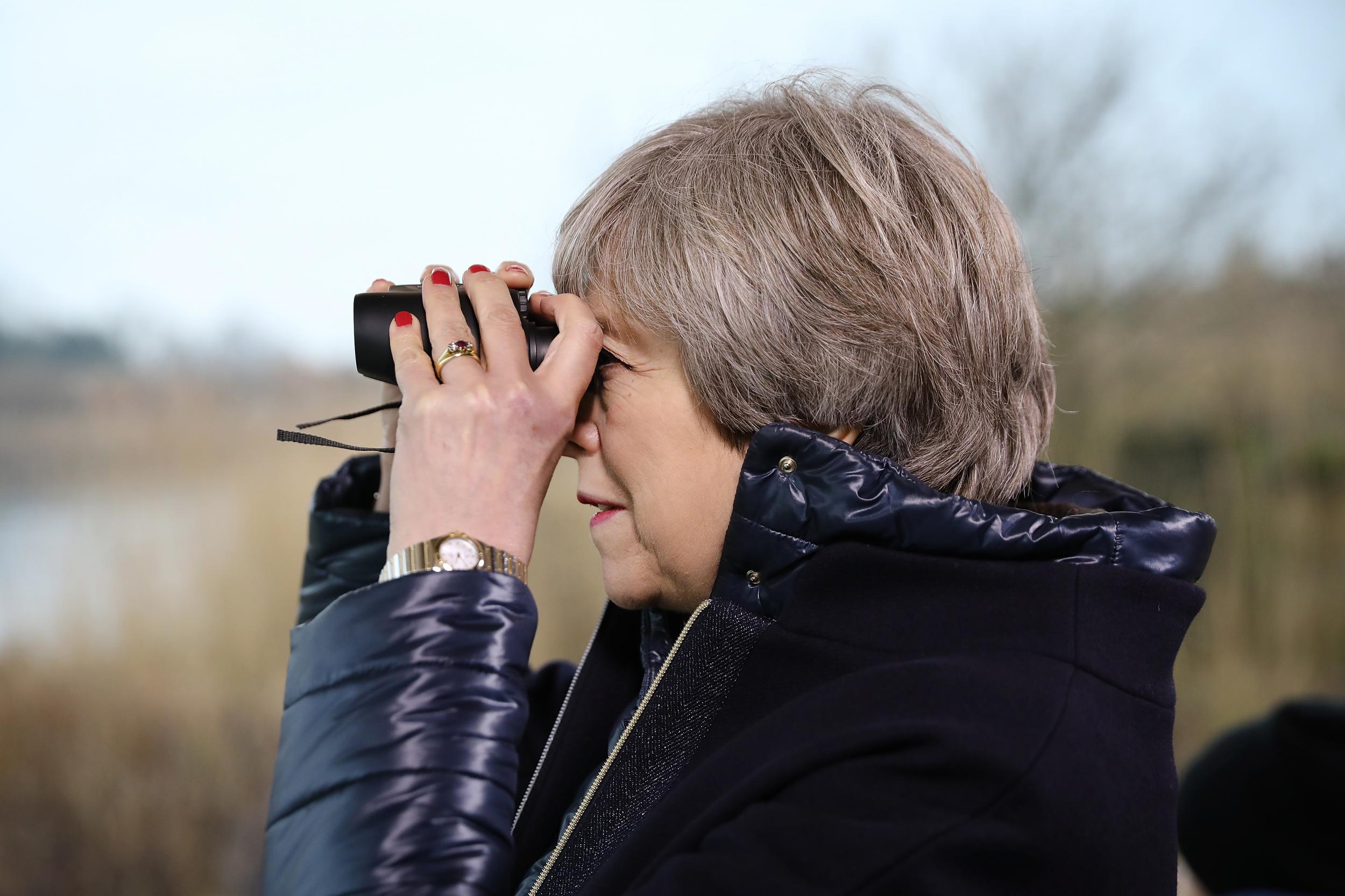 Theresa May watches birds after launching her 25-year environment plan
