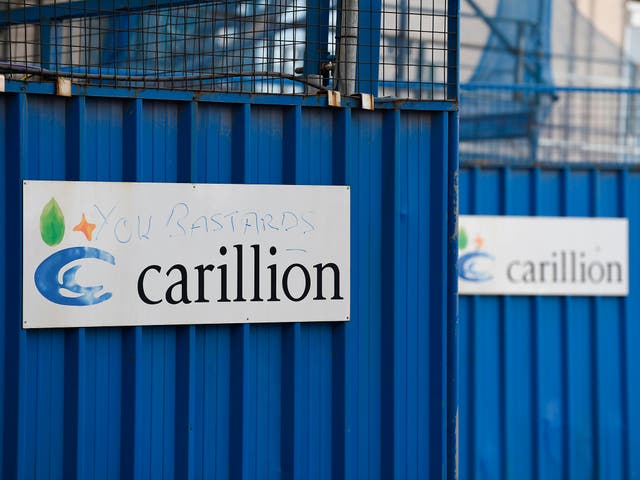 A picture shows the branding of British construction company Carillion defaced with the words "you bastards" on the hoarding at the collapsed company's  construction site at the Royal Liverpool University Hospital in Liverpool