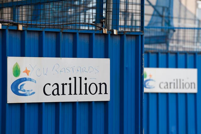 A picture shows the branding of British construction company Carillion defaced with the words "you bastards" on the hoarding at the collapsed company's  construction site at the Royal Liverpool University Hospital in Liverpool