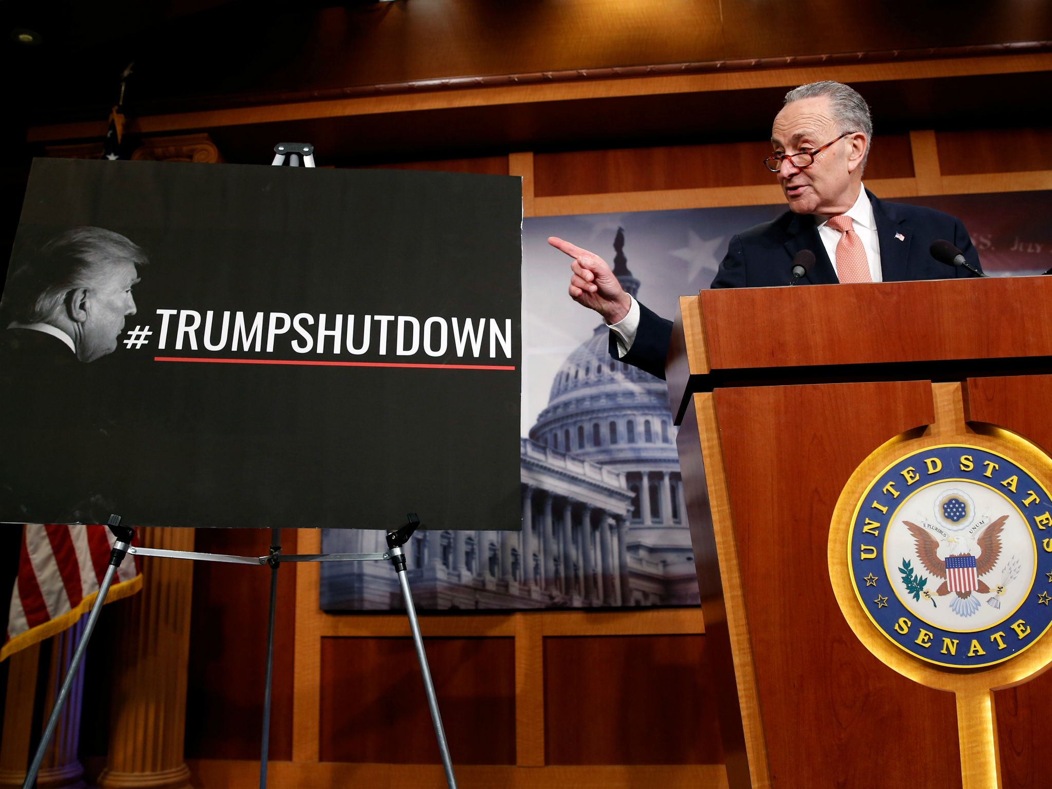 Top Senate Democrat Chuck Schumer seeks to place the blame for a government shutdown on Donald Trump during a news conference