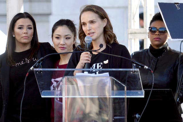 Actors Eva Longoria, Constance Wu and Natalie Portman speak during the Women's March on 20 January 2018 in Los Angeles, California.