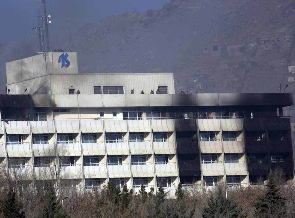 Afghan security personnel are seen at the roof of Intercontinental Hotel after an attack in Kabul, Afghanistan, Sunday, 21 January 2018