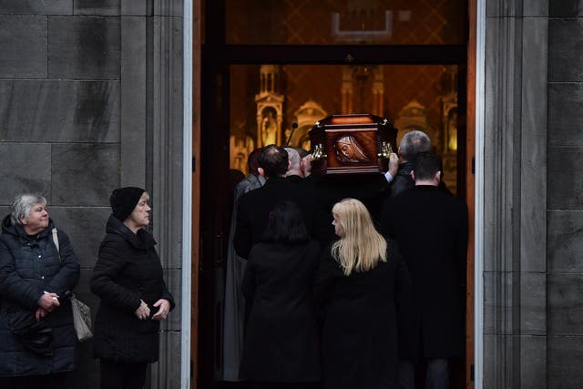 Eileen O'Riordan follows her daughter’s remains as she is carried into St Joseph’s Church