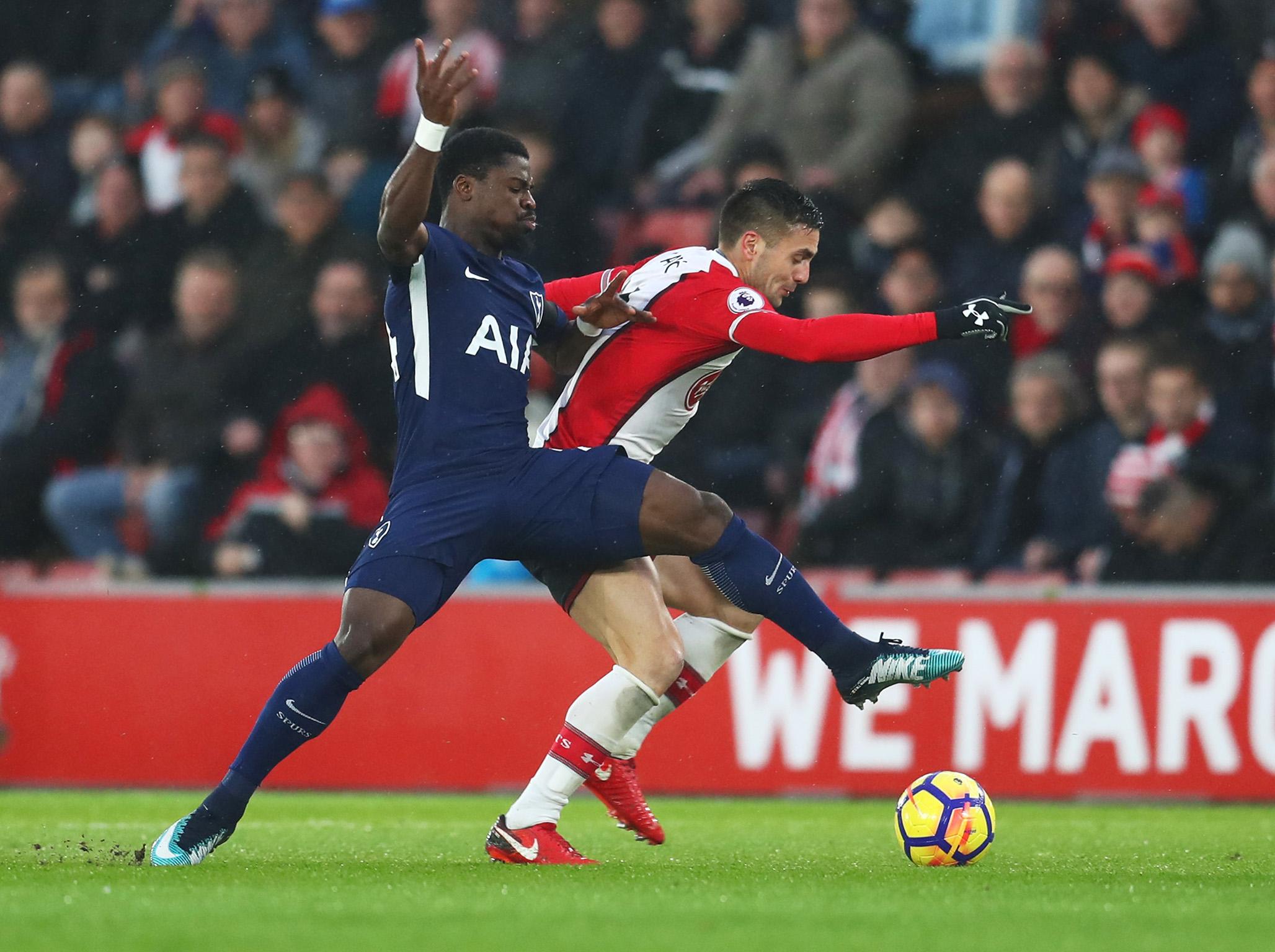 Dusan Tadic and Serge Aurier fight for possession
