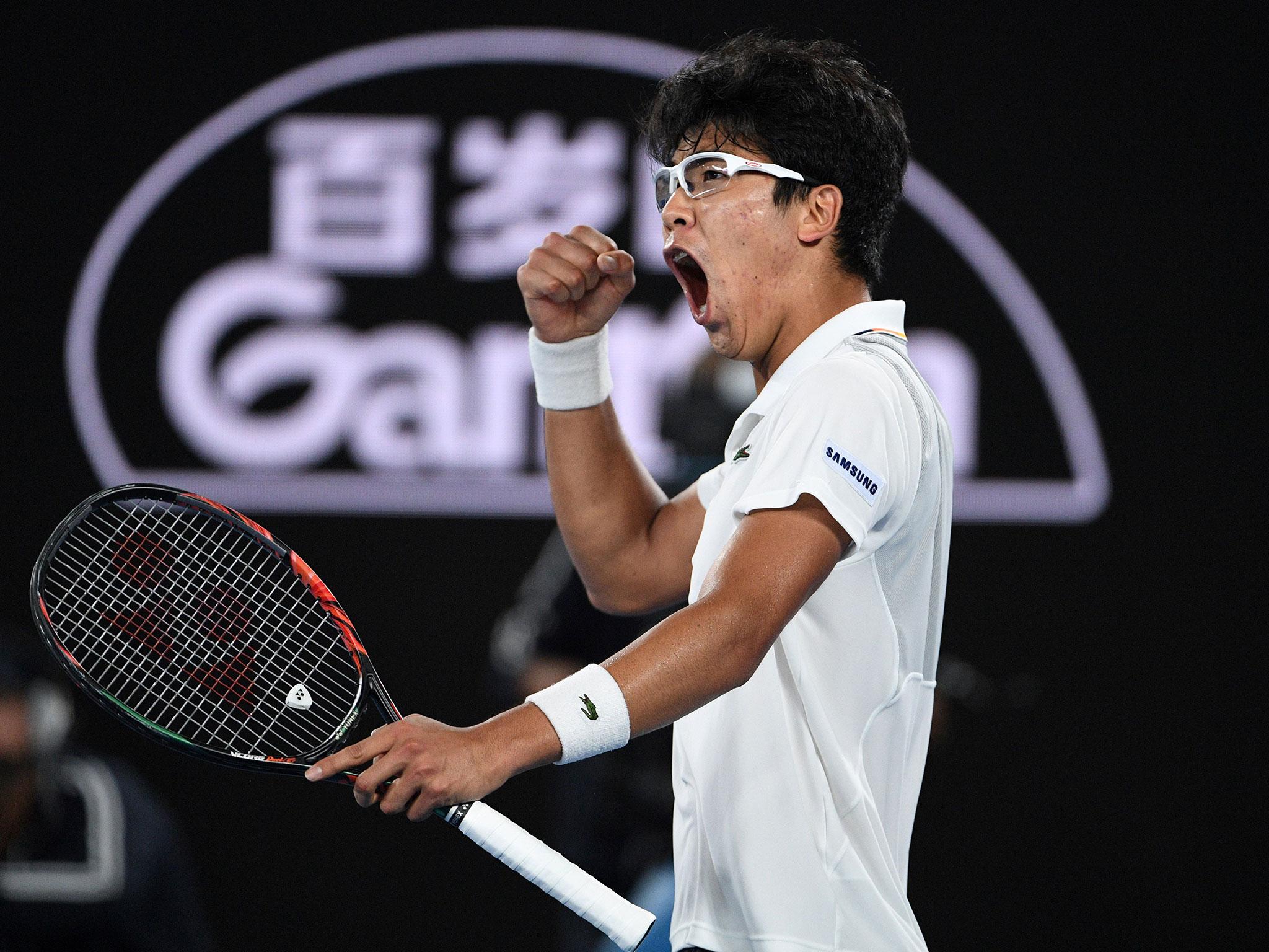 Hyeon Chung celebrates after his shock victory over Novak Djokovic